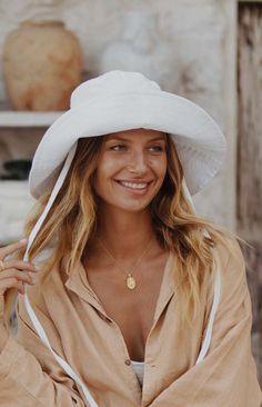 Our model is wearing a S/M hat. For specific style measurements please click the 'MEASUREMENTS' tab below. ABOUT THIS PIECEA wide-brimmed bucket hat made for all your adventures! Made from natural Linen fabric,keeping your head cool as a cucumber in the hot Summers heat. The stiffness of the brim allows for this bucket hat to be flipped up or down depending on your style. Secure this bad boy to your head by tying the 2 neckties in a bow or leave them hanging loose for a cute & casual look. A buc Cool As A Cucumber, M Hat, Bucket Hat Design, Sustainable Accessories, Contact Page, Natural Linen Fabric, Hang Loose, Summer Heat, Layered Look