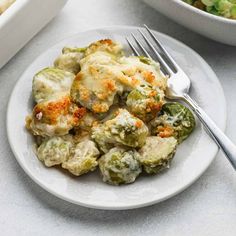 a close up of a plate of food with broccoli and cauliflower