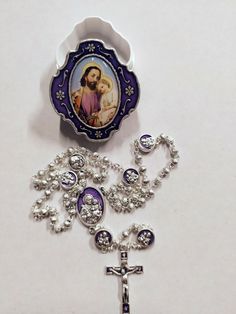 Rosary of St. Joseph in silver metal, rosary length cm 35 (13.77 inches). Pater with enamelled medal of St. Joseph on one side and the Holy Family on the other. Finely worked crucifix. Handcrafted in Italy, complete with deluxe glazed metal case with image of the Saint on the lid. Handmade by expert craftsmen in the sector with top-notch materials and quality. For an excellent success of the delivery we ask you to leave a telephone number to be delivered to the courier. The online sale of sacred Silver Cross Rosary As Gift, Spiritual Silver Rosary As Gift, The Holy Family, Saint Joseph, Caravaggio, The Saint, Holy Family, St Joseph, Hand Decorated