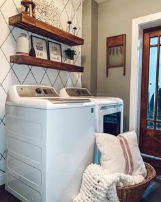 a washer and dryer sitting next to each other in a room