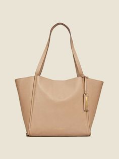 Brand: DONNA KARAN New York Main color: buff Details: Donna Karan pebbled leather tote bag. In-line shoulder straps, 12" drop. Detachable logo tag. Open top with snap closure. Inner slip pocket. 11"H x 12"W x 6.5"D. Imported. Retail price $398 Comes with dust bag Material: 100% cow leather. Condition: new with tags. 100% authentic. USA: - USPS Standard Mail - FREE SHIPPING INTERNATIONAL SHIPPING - varies by buyer's location * Shipping is worldwide. * We ship via United States Postal Service * We Beige Pebbled Leather Bag With Gold-tone Hardware, Beige Pebbled Leather Shoulder Bag With Gold-tone Hardware, Beige Pebbled Leather Satchel With Double Handle, Pebbled Leather Double Handle Shopping Bags, Classic Pebbled Leather Shoulder Bag With Handle Drop, Beige Pebbled Leather Shoulder Bag With Double Handle, Classic Pebbled Leather Bag For On-the-go, Beige Pebbled Leather Bag With Double Handle, Classic Pebbled Leather Bag