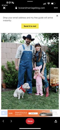 a man and woman standing next to a small dog on top of a grass covered field