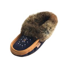 Description Details Sizing These luxurious women's moccasin slippers are classic Laurentian Chief rabbit fur slippers with a stylish twist. They have a warm and cozy fleece lining throughout the entire footbed and a beautifully soft real fuzzy rabbit fur trim/collar around the opening. These ladies indoor soft sole moccasin slippers are Canadian handmade from genuine suede in two chic colors. They come in either navy blue with a cork brown colored trim and sole or their come in rust pink with a Fringe Moccasin Boots, House Shoes Slippers, Fringe Moccasins, Soft Sole Slippers, Beaded Moccasins, Moccasin Slippers, Suede Moccasins, Comfortable Slippers, Suede Slippers