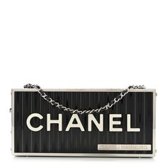 This is an authentic CHANEL Resin Enamel CC Shopping Container Minaudiere Clutch in Black, White and Red. This show-stopping clutch is crafted of glossy white and black plexiglass. This beautiful cross-body gold chain-link shoulder strap decorated in logos, and an embellished CC kiss-lock that unlatches the clutch to a leather interior. Cc Shopping, Chanel Clutch, Chanel Crossbody, Quilted Wallet, Vanity Bag, Chanel Shoulder Bag, Clutch Black, Small Clutch, Chanel Caviar