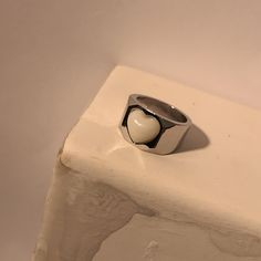 Measurement: fits size #8 Material: platinum plated brass, acrylic Trendy Silver Heart Ring For Anniversary, White Metal Promise Ring, Trendy Silver Heart Rings, Trendy Silver Heart-shaped Ring, Minimalist White Metal Rings, Minimalist White Metal Ring, White Stainless Steel Ring, Silver Enamel Promise Ring, White Stainless Steel Ring Jewelry