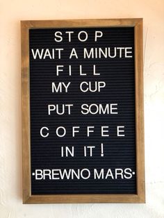 a sign that says stop wait a minute fill my cup put some coffee in it