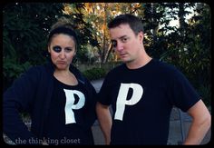 two people standing next to each other with letters painted on their t - shirts that read p and p