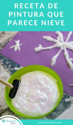 a green bowl filled with white powder next to snowflakes on top of a table