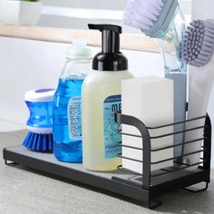 a bathroom caddy with soap, toothbrushes and other hygiene products on it