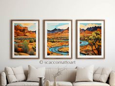 three paintings hang on the wall above a couch in front of a white sofa and coffee table