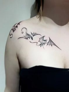 a woman with a tattoo on her shoulder