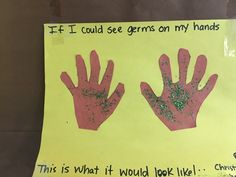 a yellow paper sign with pink and green handprints that says if i could see germs on my hands, this is what it would look like