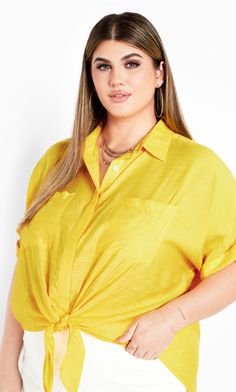 Take some sunshine with you wherever you go in the yellow Relaxed Summer Shirt. Made with a classic collared neckline and short cuffed sleeves, this button-down front and relaxed fit top is finished with a tie front detail for a trendy twist!  Key Features Include:  - Collared neckline  - Short cuffed sleeves  - Buttoned front  - Two breast pockets  - Relaxed fit  - Unlined  - Tie front detail  - Hip length  Wear it over your favorite swimsuit with some sandals and denim shorts for the beach! Linen Shorts Women, Sunset Hues, Fashion Promotion, The Ray, Online Tops, Chic Woman, City Chic, New Tops, Linen Women