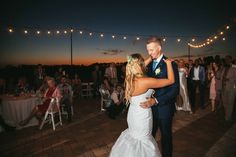 a bride and groom sharing their first dance