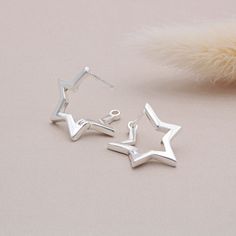 Stars are often seen as a symbol of guidance, protection, and hope, the perfect symbol to carry around with you. These beautiful hoop earrings would make a wonderful gift or treat for yourself. Bang on trend they are perfect for trendsetters everywhere. Instructions for use: To open them you must flick the back of the post upwards this will then allow you to open up the earring. To securely close them once they are in your ear you must align the earring post with the hole and insert it.  Width: Star Hoop Earrings, Earring Post, Star Earrings Stud, Celestial Jewelry, Waterproof Jewelry, Star Studs, Stainless Steel Earrings, Jewelry Earrings Hoops, Dainty Jewelry