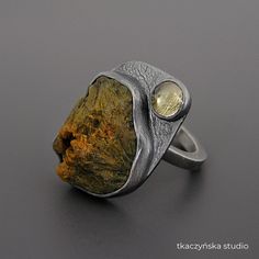 "Raw Jasper and Citrine Ring, Rough Gemstone Textured Ring, Organic Pattern Cocktail Ring, Big Contemporary Rustic Ring, Unique Massive Ring Massive ring with two stones: cabochon cut from a yellow and green raw jasper rock and a tiny citrine. Deep gray patinated.  Unique and organic. Materials:  Sterling silver (925 silver), jasper, citrine Dimensions of the stones: jasper 20 x 16 (25⁄32 x 5⁄8 in), citrine 6mm (15⁄64 in) Dimensions of the ring: width 25 x 18 mm (63⁄64 x 45⁄64 in), the width of the band 2,5 mm (3⁄32 in) Weight: 10,3 g (0,36 oz) Size:  internal diameter 16,76 mm (21⁄32 in) Size:  Europe 13,  Great Britain M,  USA 6¼, France 53, Germany 16½, Japan 12 Please check out the detailed size charts for S, M, and L sizes in the last photos.  The ring is not adjustable, but its size Jasper Rock, Jewlery Rings, Rustic Ring, Rustic Rings, Raw Stone Ring, Organic Pattern, Pattern Ring, Rustic Contemporary, Textured Ring