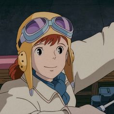 an anime character wearing goggles and holding her arm out to the side with one hand