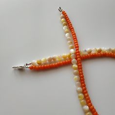 < Coral necklace with nacre beads > The pearls are natural nacre beads. Like 99% of the coral on the market these days, this coral has been dyed. I use bamboo coral which is not endangered or threatened in any way, unlike natural pink or red coral (the production of which is forbidden almost everywhere in the world). Bamboo coral doesn't mean it's not organic. Every bead of it has a distinctive and beautiful coral pattern. My jewelry dyed with high quality paint. It's safe for your health Spiritual Orange Beaded Necklace, Orange Beaded Necklaces With Lobster Clasp, Orange Round Beaded Necklace With Lobster Clasp, Orange Necklace With Round Beads And Lobster Clasp, Orange Necklaces With Round Beads And Lobster Clasp, Coral Beaded Pearl Necklace As Gift, Orange Polished Bead Necklace As Gift, Gift Coral Beaded Pearl Necklace, Orange Beaded Necklace With Polished Beads As Gift