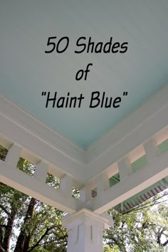 the words, 50 shades of hant blue are in front of an image of trees