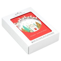 a christmas ornament in a white box