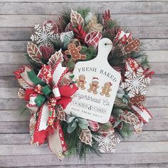 a christmas wreath with gingerbreads and cookies on it