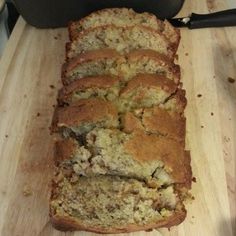 a loaf of bread sitting on top of a wooden cutting board