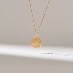 Circle Sunshine Pendant Necklace/ Solid Gold Necklace/ Womens Gold Sun Pendant/ Dainty Gold Disc Necklace/ Handmade Sunrise Pendant Features * Made to Order. * Gold KT: 14KT * Custom Gold Color: Yellow Gold * Charm 15.00 mm x 15.00 mm * Charm Thickness: 1.10mm * Ready to Ship in 5-7 Business Days ✓ We care about the environment,the jewelry we cast is made with recycled gold. We source exclusively post-consumer material that is refined back to their pure elements to ensure that the gold is in the 14k Yellow Gold Jewelry With Sun Design, Engraved Celestial 14k Gold Necklace, Sterling Silver Jewelry With Sun Design In Yellow Gold, Celestial Engraved 14k Gold Necklace, 14k Yellow Gold Sun Design Jewelry, 14k Gold Necklaces With Sun Design, Spiritual Yellow Gold Jewelry With Sun Design, 14k Yellow Gold Sun Design Necklace, Yellow Gold Medallion Necklace With Sun Design