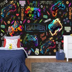 a room with a bed, dresser and wallpaper that has video game stickers all over it