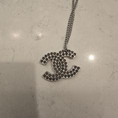 This Is A Great, Unique Chanel Silver Necklace From The 2003 Spring Collection! It's 18 Inches Long, In Great Condition! Has Its Hallmark Plate On The Lobster Claw Clasp (As Shown)! The Double Cc Has Unique Holes Throughout The Pendant Itself! This Does Come With It's Chanel Box! Any Questions, Please Ask! Thanks! Chanel Box, The Lobster, Chanel Jewelry, The Double, Spring Collection, Lobster Claw, Womens Jewelry Necklace, Hallmark, Silver Necklace