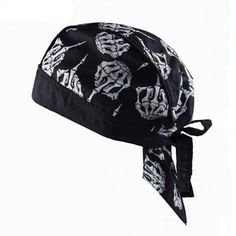 a black and white bandana hat with skulls on the front, tied to it