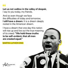 martin luther king speaking into microphones in front of a quote from martin luther king