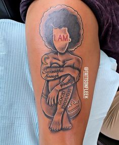 a woman with an afro on her arm