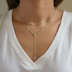 This dainty Y-Lariat necklace hangs on a delicate, diamond-cut cable chain from our signature O Collection. Pair it with other necklaces from this collection. Our patented connectors let you easily link and layer necklaces in any order you desire. Drop Height 3.5in (8.9cm) Adjustable chain: 15-17in (38-43cm) When layered, chain length is: 15-21in (38-53cm) Learn more .925 Sterling Silver Spring clasp closure Hypoallergenic, lead and nickel free #321S Layer Necklaces, Lariat Necklace Silver, Minimal Gold, Silver Necklace Set, Layered Chain, Necklace Sets, Delicate Chain, Silver Spring, Multi Strand Necklace