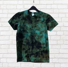 Conquer the unknown with our men's bleached t-shirt in vibrant electric blue! Hand-dyed with eco-reactive dyes in sustainable cotton, each tee boasts a unique blue bleach dye design. Dare to stand out and make an eco-conscious statement. Green Bleached Cotton T-shirt, Green Bleached Short Sleeve T-shirt, Bleached Green Cotton T-shirt, Casual Washed Tie-dye T-shirt, Summer Blue Hand Dyed T-shirt, Streetwear Tie Dye Washed T-shirt, Streetwear Washed Tie-dye T-shirt, Casual Hand-dyed Tie-dye T-shirt, Bleach Tie Dye