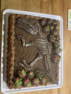 there is a cake that looks like a skeleton in the sand