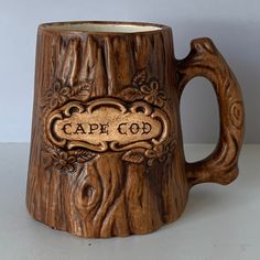 a wooden mug with the word cape co carved into it