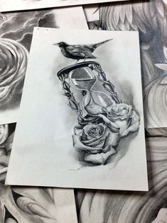 pencil drawings of roses and an hourglass with a bird sitting on top of it