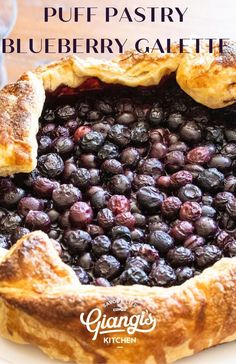 blueberry pie with puff pastry crust in the middle and text overlay that reads, puff pastry blueberry galette