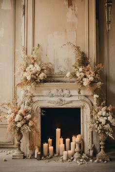 a fireplace decorated with flowers and candles