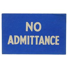 a blue and white sign that says no admitance on the bottom half of it