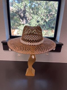 Wide brim straw cowrie seashell western summer cowgirl/cowboy hat. Please note each item is handmade so may have minor imperfections, but is constructed to the best of my ability. Thank you for understanding! Beaded Fedora Sun Hat For Vacation, Handmade Summer Hat In Paper Straw, Summer Brown Beaded Hat, Beaded Beach Fedora With Short Brim, Beaded Fedora Sun Hat For Rodeo, Summer Beach Fedora With Beaded Details, Beaded Fedora Hat For Vacation, Beaded Brimmed Straw Hat For Vacation, Beaded Brimmed Fedora For Beach