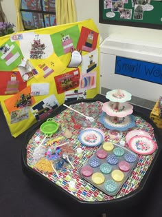 there is a table that has many different items on it, including cakes and cupcakes