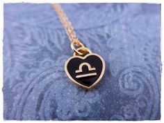 "Black enameled gold plated alloy Libra heart charm measures 14x12mm and is reversible. The same design is on both sides. Chain lengths range from 14 to 30 inches (even lengths). The length shown in the photo is 18 inches. It comes beautifully gift wrapped; perfect for gift giving! Want just the charm? Choose \"Charm Only\" from the drop down box to checkout. More Libra Jewelry: https://etsy.me/3N2MUyj More Zodiac Jewelry: http://etsy.me/1RI1RBn If you have any questions, please contact me befor Gold Heart Jewelry With Black Enamel, Libra Jewelry, Libra Necklace, Star Chain, Meme Design, Zodiac Jewelry, Necklace Black, Gold Enamel, Black Heart