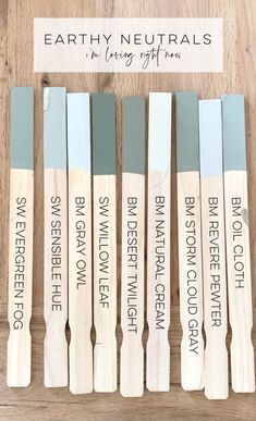 six wooden crochet hooks with the words earthy neutrals in black and white