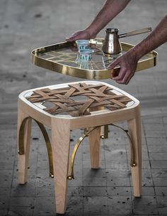 a man is working on a small table