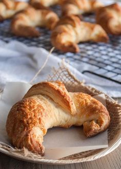 some croissants are sitting on a plate