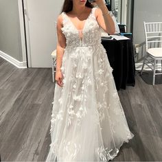 a woman taking a selfie in a wedding dress