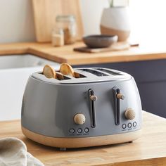 a toaster sitting on top of a wooden counter