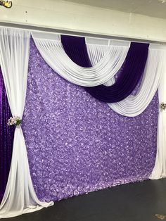 a purple and white backdrop with sheer drapes