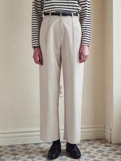 This product exemplifies modern sophistication with a minimalist design that complements a variety of styles. The Light Semi-Wide Cotton Pants are tailored to offer a comfortable, semi-wide fit that flatters the form while allowing for ample movement. With their crisp lines and structured fabric, these pants present a polished aesthetic suitable for both formal and casual settings. - Crafted from premium cotton, these pants offer breathability and comfort for all-day wear.- The semi-wide cut of these trousers ensures a contemporary look with a hint of relaxed elegance.- Equipped with a clean waistline and discreet pockets, the design maintains a sleek and uncluttered profile.- A concealed closure system adds to the seamless look, enhancing the garment's modern charm. Chic Tailored Cotton Pants, Modern Fitted Beige Wide Leg Pants, Modern Relaxed Fit Pants For Spring, Modern Wide-leg Dress Pants, Modern Ankle-length Relaxed Fit Pants, Modern Ankle-length Wide Leg Pants For Spring, Modern Tapered Pants For Fall, Modern Relaxed Fit High-waisted Dress Pants, Modern Tailored Wide Leg Pants For Spring